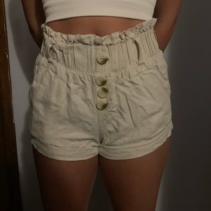 American Original Rewash Brand light brown shorts.